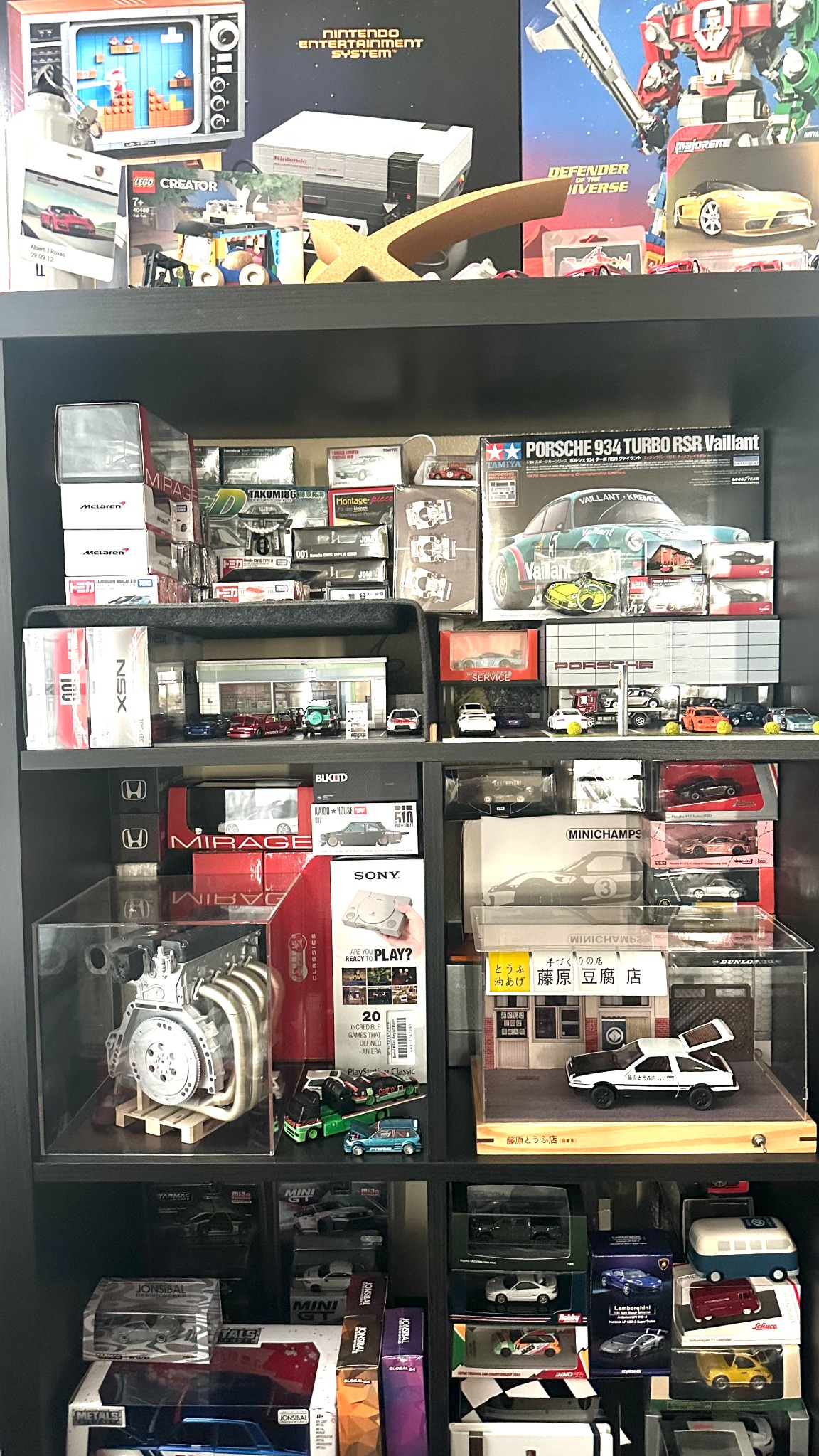 Shelves displaying diecast cars, model kits, and collectible toys